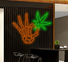 Load image into Gallery viewer, Skeleton arm with cannabis neon sign, Skellihand with cannabis Neon Sign