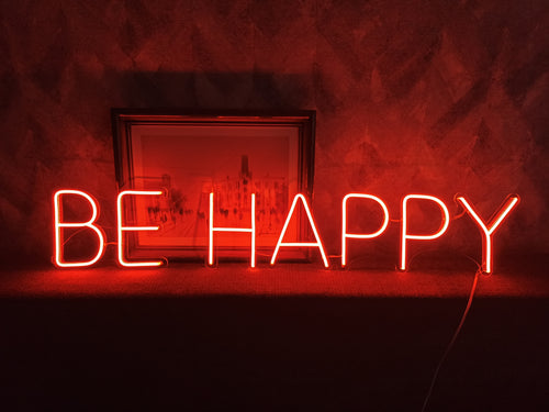 Neon sign be happy