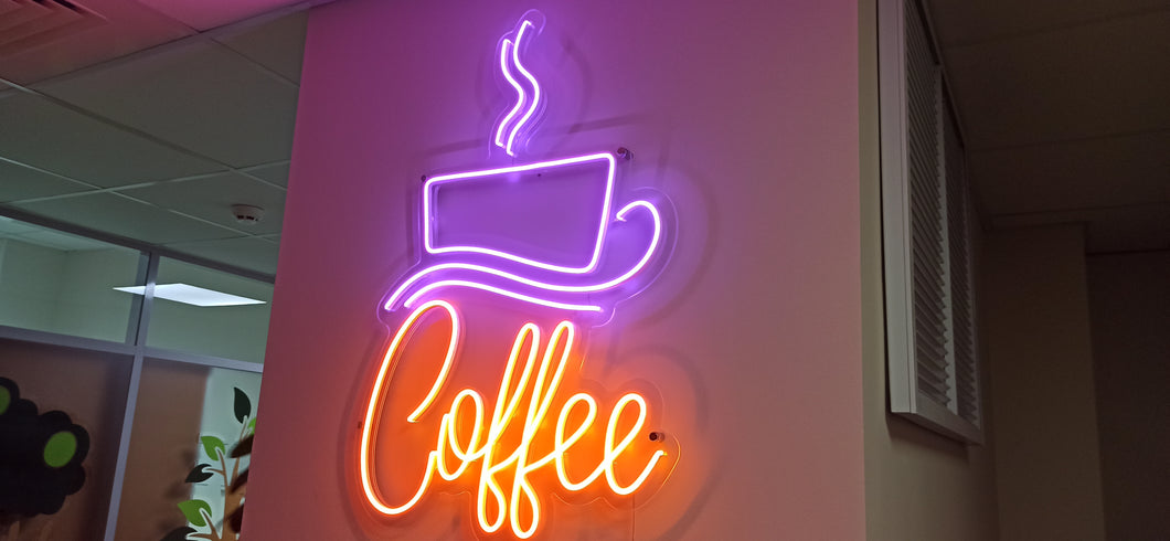 Neon coffee cup neon sign with coffee written on it is